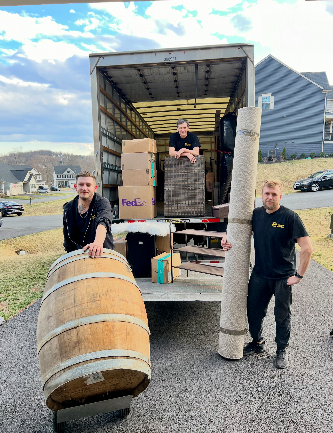 golden-tape-movers-spring-moving Golden Tape Movers team moving items in spring, preparing for spring planting in a new home