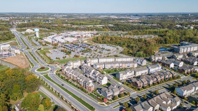 Discover Clarksburg MD – Professional Moving Services by Golden Tape Movers Aerial view of Clarksburg MD residential neighborhoods and shopping center, ideal for families relocating with Golden Tape Movers.